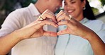 Marriage, heart hands and couple with support, smile and cheerful with relationship, commitment and bonding. Quality time, happy man and woman with love symbol, hug and anniversary with happiness