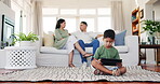 Family, tablet and kid in home living room, gaming and streaming movie, online video or film. Mother, father and child on floor with technology for learning, internet or web app in house with parents