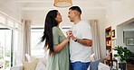 Happy, couple and dance in home for love, care and bonding together. Man, woman and moving with intimate romance to music, commitment for marriage or holding hands for celebration, smile or affection