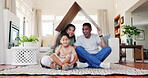 Roof, house and smile with family in living room for property, investment or support. Safety, mortgage and real estate with portrait of parents and child with cardboard for home insurance or security