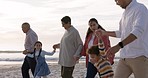 Family, children and happy family holding hands at beach for fun vacation, holiday or adventure. Men, women or parents and grandparents with kids for quality time with love and care outdoor at ocean
