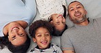 Love, happy and face of family relaxing on a bed together and laughing for a comic or funny joke. Happiness, smile and top view portrait of children lying with parents for bonding in bedroom at home.