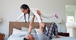 Father, girl and kid in home for airplane games, quality time and fun bonding in bedroom. Happy dad lifting child to fly for freedom, fantasy and trust of support, balance and laughing with energy 