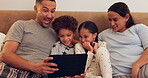 Tablet, home or excited family streaming a movie as a family to relax on weekend on sofa in the morning. Parents, mom or dad watching film, series online or social media with happy children siblings 