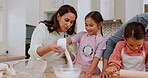 Kitchen, sugar and happy family children baking dessert, food or prepare recipe ingredients with help from mom, dad or parents. Teaching, cup and home father, mother and kids learning cooking skills