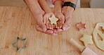 Star, dough and hands baking shape, icon and symbol in a kitchen table or counter while cooking dessert in a home. Child, learning and baker parent help or teaching kid to make cookies as support