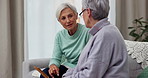 Retirement, care and senior women with holding photographs in nursing home for conversation. Friends, talking and memory with elderly female on sofa with photo frame for nostalgia with sisters.