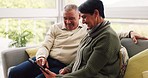 News, senior and a couple with a tablet on the sofa for social media, app or the internet. Relax, website and an elderly man and woman typing on technology, streaming and reading information