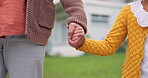 Parent, child or family holding hands outdoor in a backyard for love, care and trust. Closeup of a person and girl kid together for quality time, security and guidance or support for development