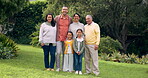 Happy family, grandparents and portrait outdoor at a park with love and care. Senior man and woman with young parents and children together in a garden for quality time, bonding and fun holiday