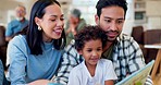 Happy parents, child and reading book in family home for learning, language development and teaching support. Father, mother and boy kid relax for quality time, storytelling and laughing together