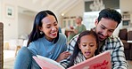 Happy, pride and a family reading a book for education, child development and bonding. Laughing, care and young parents with a girl kid and a story together in the living room of a home for love