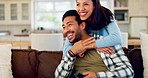 Watching tv, man and woman hug sofa in living room with love, smile and relax in home together. Marriage, movies and happy couple embrace on sofa in apartment with television, streaming and happiness