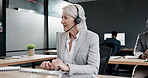 Typing, talking and a mature woman in a call center for telemarketing, support or consulting. Happy, contact us and a senior customer service agent speaking for online advice and email in an office