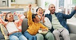 Wow, celebration and popcorn with a family watching tv together on a sofa in the living room of their home. Children, parents and streaming a subscription service with a group of sports fans cheering