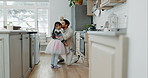 Ballet, kiss and father with daughter in kitchen for support, love and dance. Happy, ballerina and music with man and young girl dancing in family home for learning, excited or happiness together