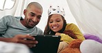 Tablet, father and child in tent in home for learning, streaming online movie or internet video, film or social media. Dad, technology and relax with happy girl with crown, bonding and smile together