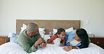 Family, funny and parents with teddy bear in bedroom, bonding and relax together. Father, mother and girl child with toys, stuffed animal and happy, play and laugh for quality time on bed in house