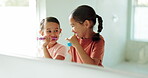 Siblings, home or happy kids in bathroom brushing teeth in morning grooming routine as siblings. Children, oral care or girls cleaning mouth together with toothbrush or toothpaste for dental health 