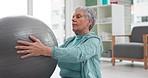 Senior woman, exercise and ball in home for fitness, wellness and workout in retirement. Old lady, movement and mobility with equipment on floor in living room for care of healthy muscle development 