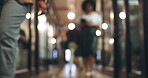 Blurred background, people and walking in the office, business or workplaace with professional employees or staff.  Company, lobby and workers moving in the hall, corridor and hallway in agency