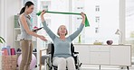 Senior woman with disability, physiotherapist and stretching band for muscle rehabilitation, healthcare assessment and chiropractor services. Physiotherapy, healing and support patient in wheelchair