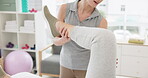 Physiotherapy, stretching and medical training for patient with an injury for recovery as therapy rehabilitation. Joint, health and physiotherapist help person or client with knee motion and support