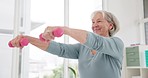 Fitness, strong and a senior woman with dumbbells for arm training, wellness and health in retirement. Happy, gym and an elderly person with workout gear for an exercise, sport or weightlifting