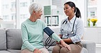 Doctor, senior patient and blood pressure check with consultation, talking and help, health in hospital office. Women at clinic, communication and cardiovascular healthcare, elderly care and support