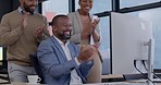 Clapping hands, celebration and business people in the office by a computer for teamwork success. Diversity, good news and group of professional corporate lawyers cheering by technology in workplace.