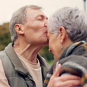 Forehead, kiss and senior couple in a park with love, happy and ...