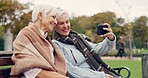 Senior, women and selfie in a park happy, bond and relax in nature on a bench together. Friends, old people and ladies smile for social media, profile picture or memory in forest chilling on weekend