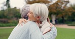 Love, care and senior women embracing for affection, romance and bonding on an outdoor date. Nature, commitment and elderly female couple in retirement hugging in a green garden or park together.