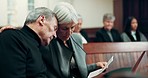 Sad, hug and senior couple at a funeral with support, love and crying together in a church. Death, grief and an elderly man and woman with tears, comfort or unhappy sorrow at a memorial service