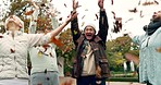 Autumn, elderly friends throwing leaves and freedom with a group of people outdoor in a park together. Comic, nature and fun with happy senior citizens in a garden for bonding during retirement