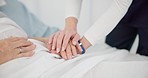 People, holding hands and care for life, support or trust in commitment, understanding or grief at hospital. Closeup of women touching in healthcare for loss, illness or virus on bed at the clinic