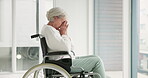 Sad, senior woman and person with disability, wheelchair and crying into hands at the hospital, window or nursing home. Depressed, mental health and elderly person frustrated, thinking in retirement