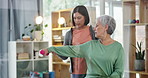 Physiotherapy, dumbbell and senior patient exercise with a woman for physical therapy or rehabilitation. Elderly person with a physiotherapist for muscle workout, support or health care in retirement