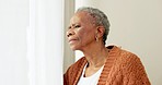 Confused, senior and a black woman at a home window with anxiety, stress or suspicious. Fear, nosy or an elderly person looking through a curtain for a view, problem or intruder concern in a home