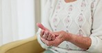 Hands, pain and arthritis with an old woman in her nursing home, struggling with a medical injury or problem. Healthcare, ache or carpal tunnel with a mature resident in an assisted living house