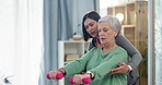 Physiotherapy, senior patient and dumbbell exercise with a woman for physical therapy or rehabilitation. Elderly person with a physiotherapist for muscle workout, support or health care in retirement