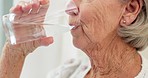 Thirsty, closeup and senior woman drinking water for hydration and liquid diet detox at home. Wellness, health and calm elderly female person enjoying glass of cold drink in modern retirement house.