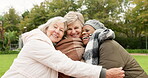 Senior, hug and relax with friends in park for retirement, happy and health. Elderly, happiness and social with portrait of old women in embrace in nature for wellness, smile and peace together