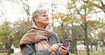 Phone, navigation and a senior woman in the park, looking lost while searching for a location on a map app. Mobile, direction and location with an elderly female person walking in an outdoor garden