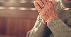 Senior, woman and praying with rosary in church with hands for faith with healing in jesus christ. Closeup, mediation and spiritual elderly female at cathedral for peace or forgiveness with god.