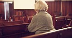 Prayer, church and christian senior woman on a bench for a spiritual congregation service on a Sunday. Faith, peace and back of elderly female person in retirement praying before sermon in cathedral.