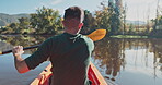 Kayak, river and back view of man on an adventure to explore the water by rowing while camping in nature. Boat, canoe and person in a lake for vacation or holiday in the countryside for freedom