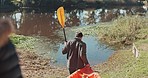 Lake, walking and rowing boat with people carrying kayak for fitness and journey in nature. Couple, back and canoe for exercise and freedom outdoor with paddle and adventure together by river water