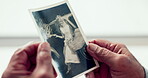 Hands, photograph and memory with a senior person thinking about the past while in a nursing home. History, vintage and retirement with an elderly adult holding a picture closeup to remember life