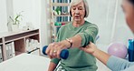 Senior care, rehabilitation and help, physiotherapist with old woman and dumbbell for healthcare at nursing home. Physio, exercise and retirement, fitness coach and elderly patient mobility training.